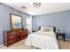 Bright bedroom featuring a queen bed and wood dresser at 35066 N Happy Jack Dr, San Tan Valley, AZ 85144