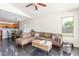 Open living area with L-shaped sofa and view into kitchen and dining area at 35066 N Happy Jack Dr, San Tan Valley, AZ 85144