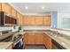 Kitchen with light wood cabinets, granite countertops, and stainless steel appliances at 35066 N Happy Jack Dr, San Tan Valley, AZ 85144