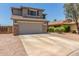 Two-story house with gray siding, stone accents, and a two-car garage at 35066 N Happy Jack Dr, San Tan Valley, AZ 85144