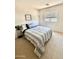 Comfortable bedroom with a double bed and side table at 35066 N Happy Jack Dr, San Tan Valley, AZ 85144