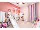 bedroom with bunk bed, slide, and colorful decor at 4455 W Suncup Dr, San Tan Valley, AZ 85144