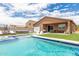 Private backyard with pool, patio furniture, and covered patio at 4455 W Suncup Dr, San Tan Valley, AZ 85144