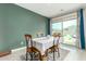 Dining area with table and chairs, sliding glass door to backyard at 4455 W Suncup Dr, San Tan Valley, AZ 85144