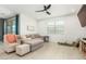 Bright living room with a comfy sectional sofa and plenty of natural light at 4455 W Suncup Dr, San Tan Valley, AZ 85144