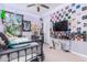Bedroom with a full-size bed and eclectic wall decor at 4455 W Suncup Dr, San Tan Valley, AZ 85144
