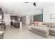 Open floor plan connecting kitchen and living room with a sectional sofa at 4455 W Suncup Dr, San Tan Valley, AZ 85144