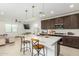 Open concept kitchen with island seating and Gathering room views at 4455 W Suncup Dr, San Tan Valley, AZ 85144