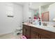 Clean bathroom with dark brown vanity, bathtub, and shower at 4455 W Suncup Dr, San Tan Valley, AZ 85144