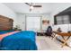 Spacious primary bedroom with large bed, TV, and workspace at 4455 W Suncup Dr, San Tan Valley, AZ 85144