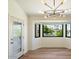 Bright dining area with water views and an adjacent door leading outside at 10309 E Cinnabar Ave, Scottsdale, AZ 85258