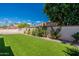 Artificial turf lawn, landscaped with mature trees and wall at 14602 N Olympic Way, Fountain Hills, AZ 85268
