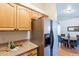 Kitchen features light wood cabinets, stainless steel appliances, and granite countertops at 14602 N Olympic Way, Fountain Hills, AZ 85268