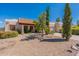 Spanish style home with a tile roof and nicely landscaped yard at 14602 N Olympic Way, Fountain Hills, AZ 85268