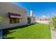Home's exterior showcasing stucco siding and a manicured lawn at 14602 N Olympic Way, Fountain Hills, AZ 85268