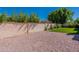 Artificial turf and gravel landscaping with a stucco wall at 14602 N Olympic Way, Fountain Hills, AZ 85268