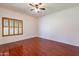 Spacious bedroom with hardwood floors and ceiling fan at 14602 N Olympic Way, Fountain Hills, AZ 85268