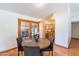 Bright dining area with a round wooden table and four gray chairs, near kitchen at 14602 N Olympic Way, Fountain Hills, AZ 85268