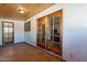 Covered patio with tile flooring, French doors, and access to backyard at 14602 N Olympic Way, Fountain Hills, AZ 85268