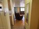 Hallway with mirror and view into living room at 652 S Ellsworth Rd # 90, Mesa, AZ 85208