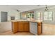 Kitchen with island, views to living room and backyard at 42425 W North Star Dr, Maricopa, AZ 85138