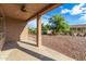Covered patio with ceiling fan and backyard view at 42425 W North Star Dr, Maricopa, AZ 85138