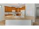 Kitchen with light wood cabinets and large island at 42425 W North Star Dr, Maricopa, AZ 85138