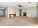 Bright living room featuring a fireplace and built-in desk at 42425 W North Star Dr, Maricopa, AZ 85138