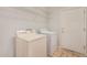 Laundry room with washer, dryer, and shelving at 42425 W North Star Dr, Maricopa, AZ 85138