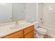 Clean bathroom with wood vanity and tub shower combo at 42425 W North Star Dr, Maricopa, AZ 85138