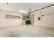 Spacious garage with overhead storage and shelving at 42425 W North Star Dr, Maricopa, AZ 85138