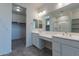 Double vanity bathroom with walk-in shower and spacious closet at 21553 W Papago St, Buckeye, AZ 85326