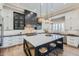 Modern kitchen with white cabinets, a large island, and stainless steel appliances at 2224 W Speer Trl, Phoenix, AZ 85086