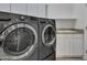 Laundry room with washer, dryer, and utility sink at 40261 N La Cantera Dr, Anthem, AZ 85086