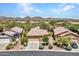 Aerial view of house and neighborhood with mountain views at 40261 N La Cantera Dr, Anthem, AZ 85086