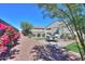 Backyard oasis with patio, seating area, and colorful flowers at 15820 S 177Th Dr, Goodyear, AZ 85338
