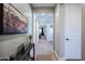 Bright hallway with wood floors and modern artwork at 15820 S 177Th Dr, Goodyear, AZ 85338