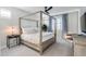 Main bedroom with canopy bed, ceiling fan, and ample natural light at 15820 S 177Th Dr, Goodyear, AZ 85338
