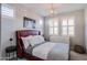 Bright bedroom with a comfortable bed, dresser, and window at 15820 S 177Th Dr, Goodyear, AZ 85338