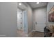 Bright hallway with wood floors and modern artwork at 15820 S 177Th Dr, Goodyear, AZ 85338
