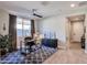 Home office with desk, rug, and view into hallway at 15820 S 177Th Dr, Goodyear, AZ 85338
