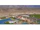 Aerial view of community with pool, lake, and clubhouse at 15820 S 177Th Dr, Goodyear, AZ 85338