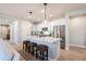 Modern kitchen island with white cabinets and stainless steel appliances at 15820 S 177Th Dr, Goodyear, AZ 85338