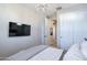 Bedroom featuring a mounted TV and a comfortable bed at 15820 S 177Th Dr, Goodyear, AZ 85338
