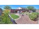 Landscaped backyard with artificial turf, patio, and seating area at 15820 S 177Th Dr, Goodyear, AZ 85338