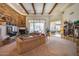 Large living room featuring a stone fireplace and ample natural light at 8300 E Dixileta Dr # 253, Scottsdale, AZ 85266