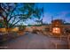 Relaxing backyard patio with stone fireplace and seating area at 8300 E Dixileta Dr # 253, Scottsdale, AZ 85266