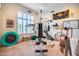 Well-equipped home gym featuring various exercise machines and weights at 8300 E Dixileta Dr # 253, Scottsdale, AZ 85266