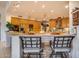 Kitchen boasts a large island with seating, wood cabinets, and stainless steel appliances at 8300 E Dixileta Dr # 253, Scottsdale, AZ 85266