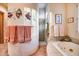 Bathroom features a walk-in shower, soaking tub, and decorative tile at 8300 E Dixileta Dr # 253, Scottsdale, AZ 85266